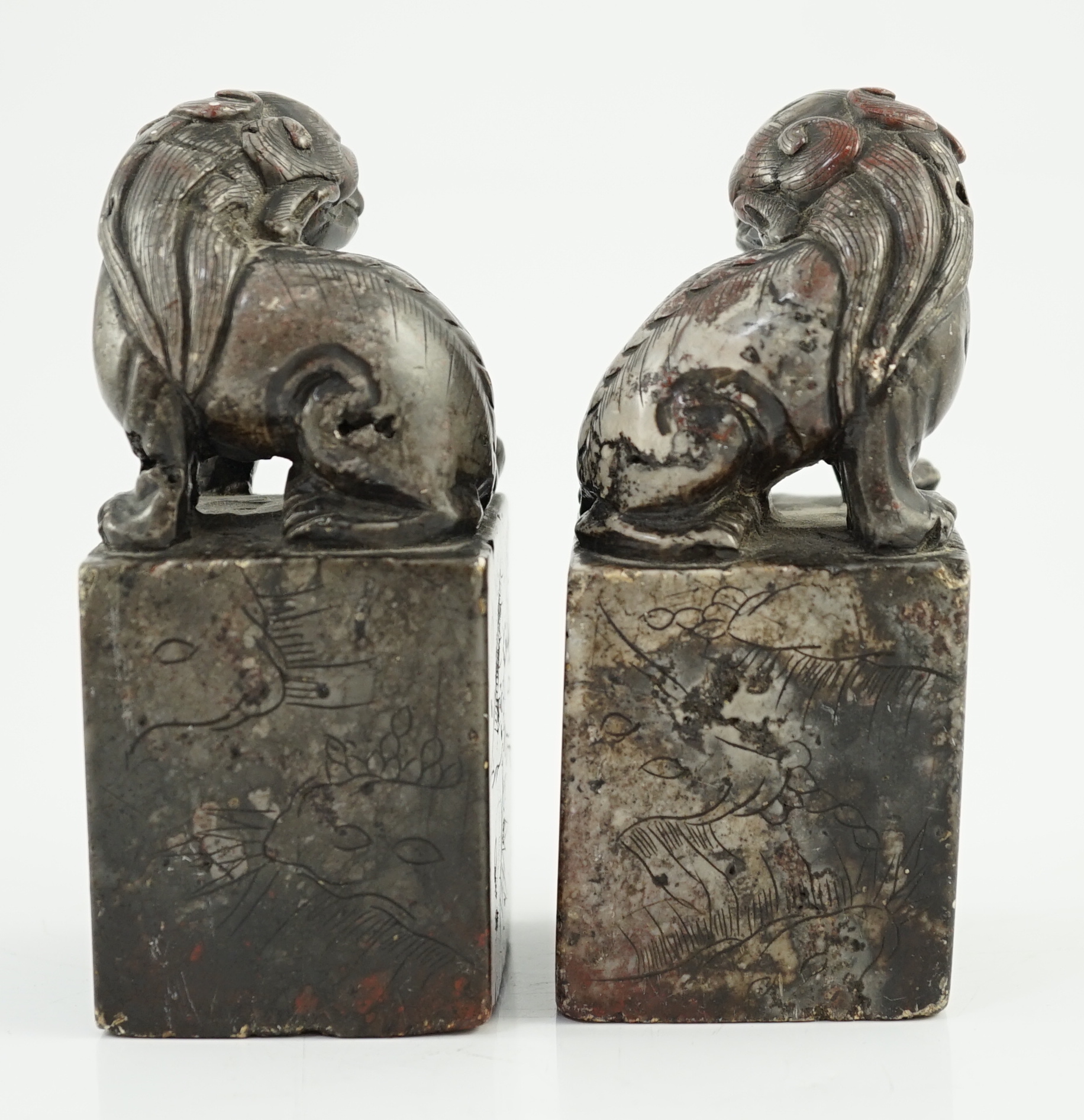 A pair of Chinese soapstone lion-dog seals, Qing dynasty